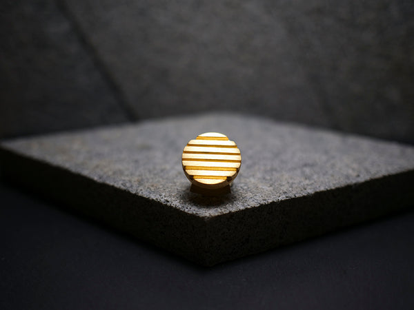 Handmade gold circle bolo tie